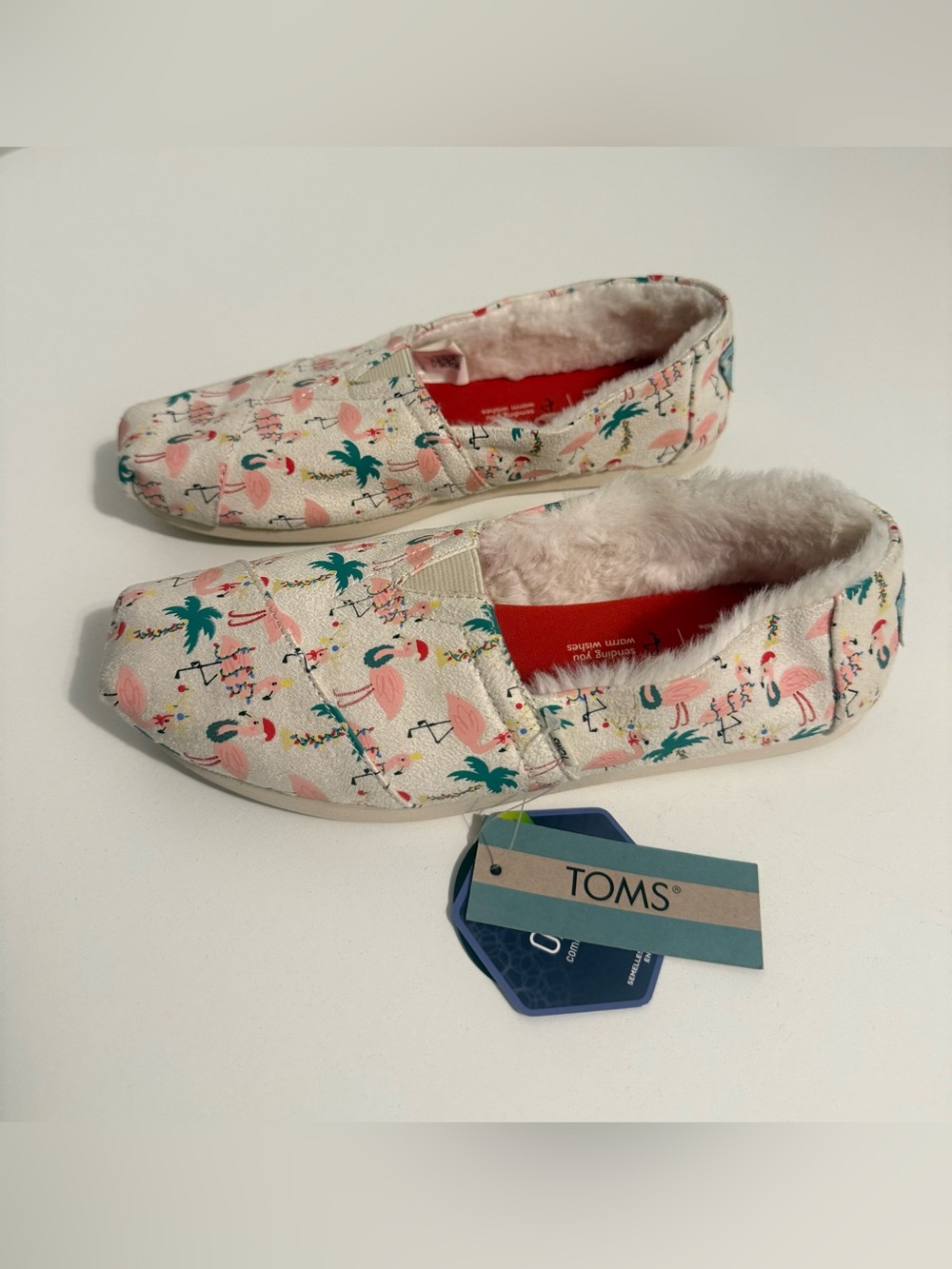 TOMS Cream Slip-Ons with Pink Flamingo, Teal Palm & Christmas print